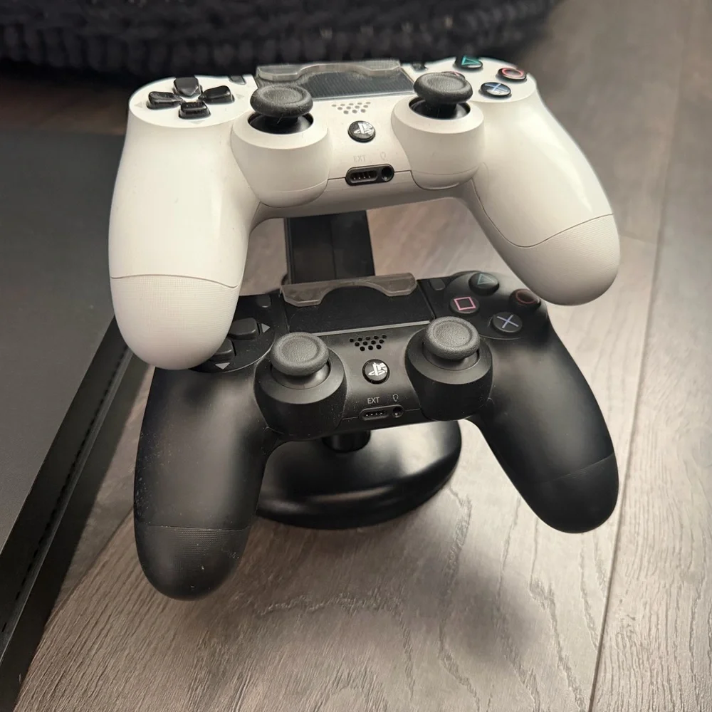 Sony PlayStation 4 with 2 Controllers and 8 Games